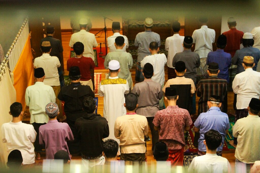 a large group of people standing in a room