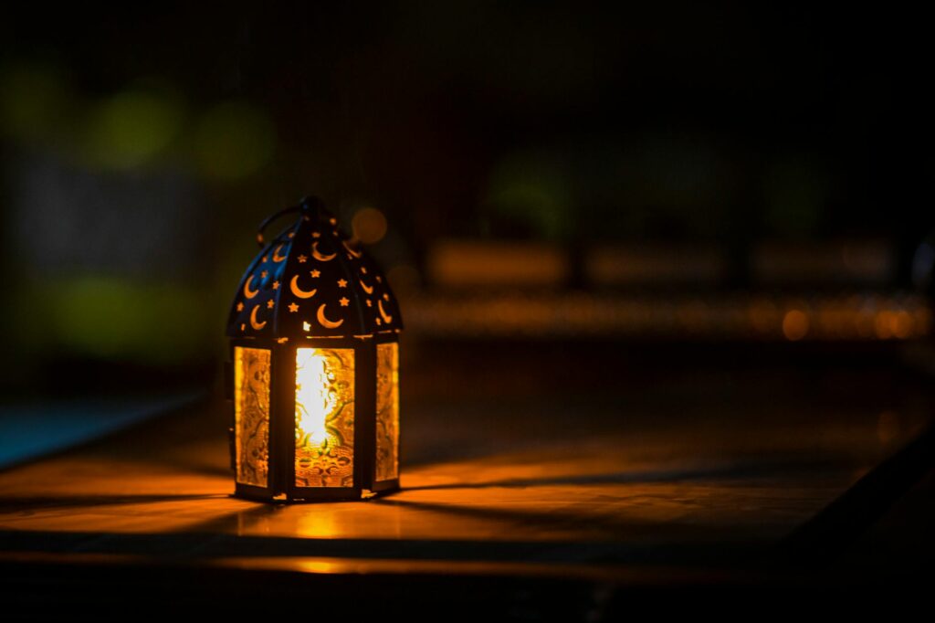 photo of ramadan light on top of table